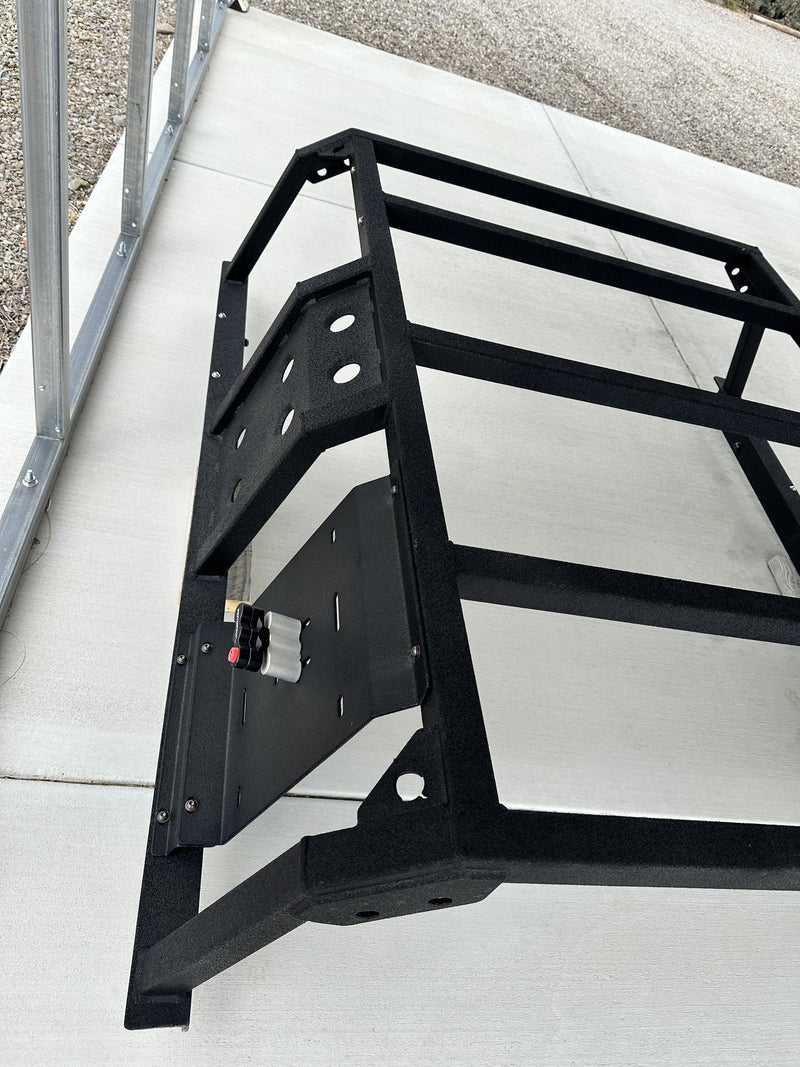 Three-quarter view of one upright showing the side plate with cutouts, the universal mounting plate carrying a Rotopax locking mount, and the bed mount bracket below — photo 3