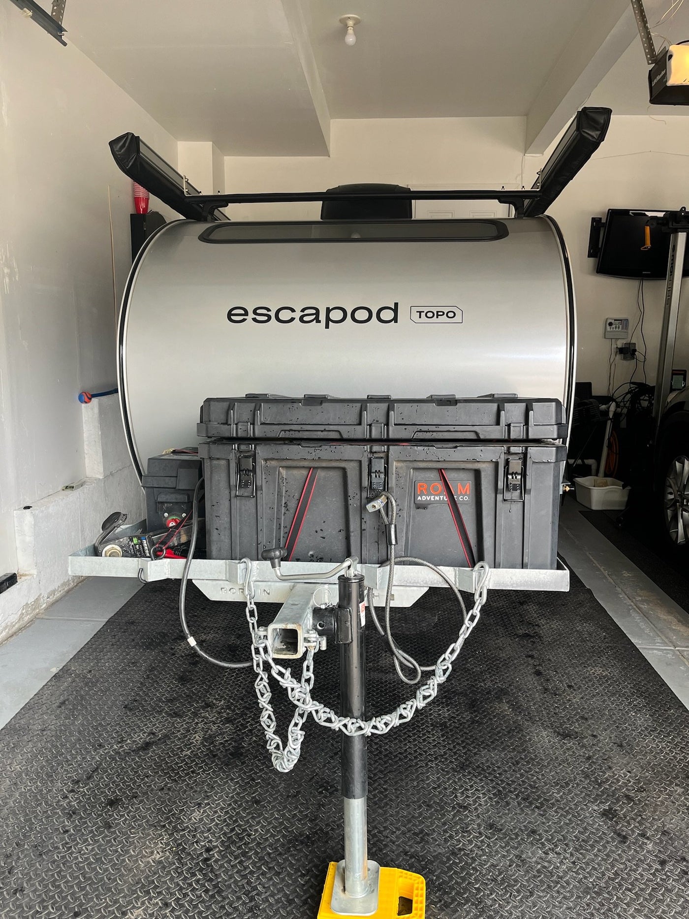 Escapod TOPO rear view showing tongue storage box, coupler and stabilizer jack — photo 4