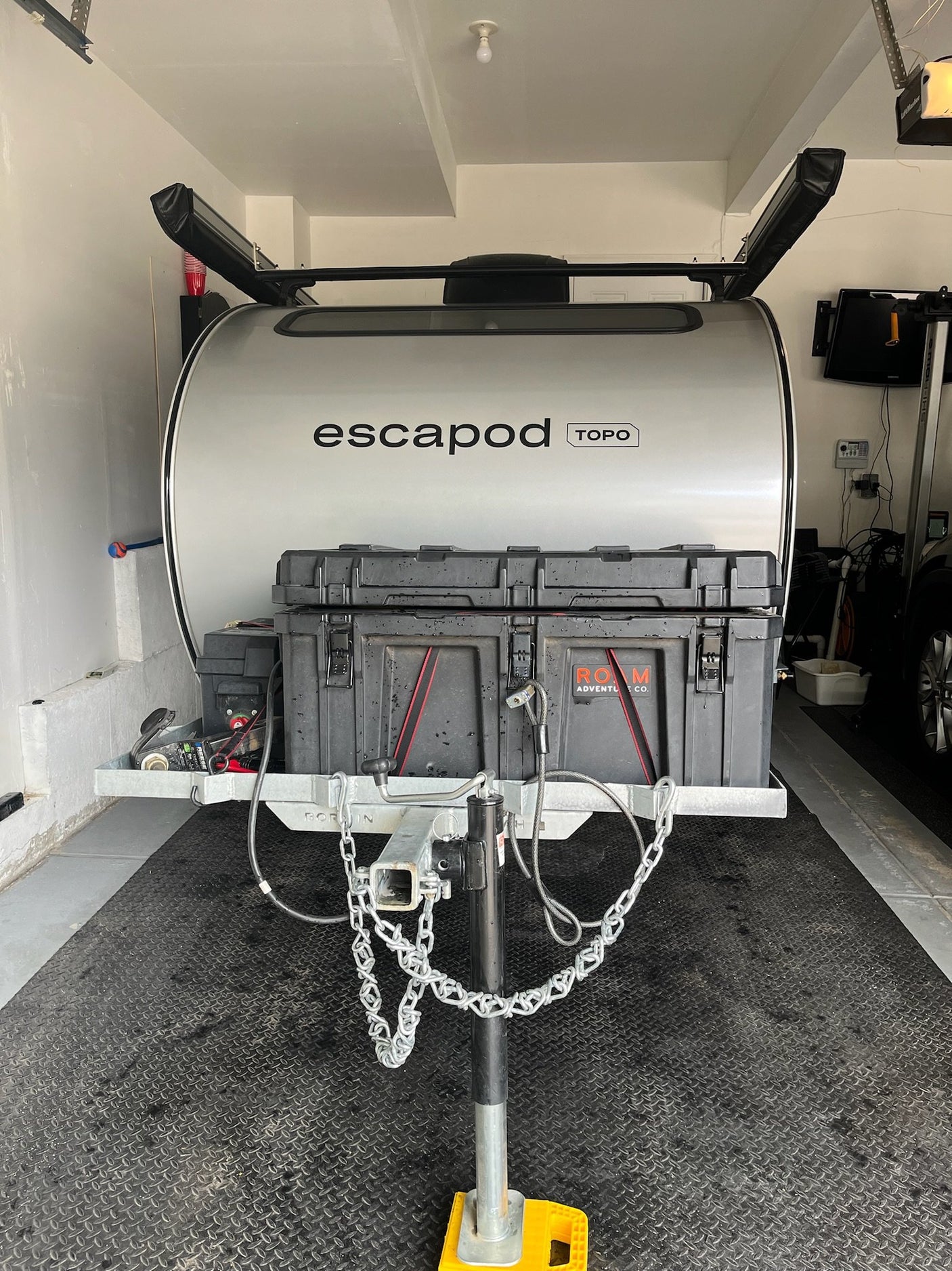 Escapod TOPO rear view showing tongue storage box, coupler and stabilizer jack
