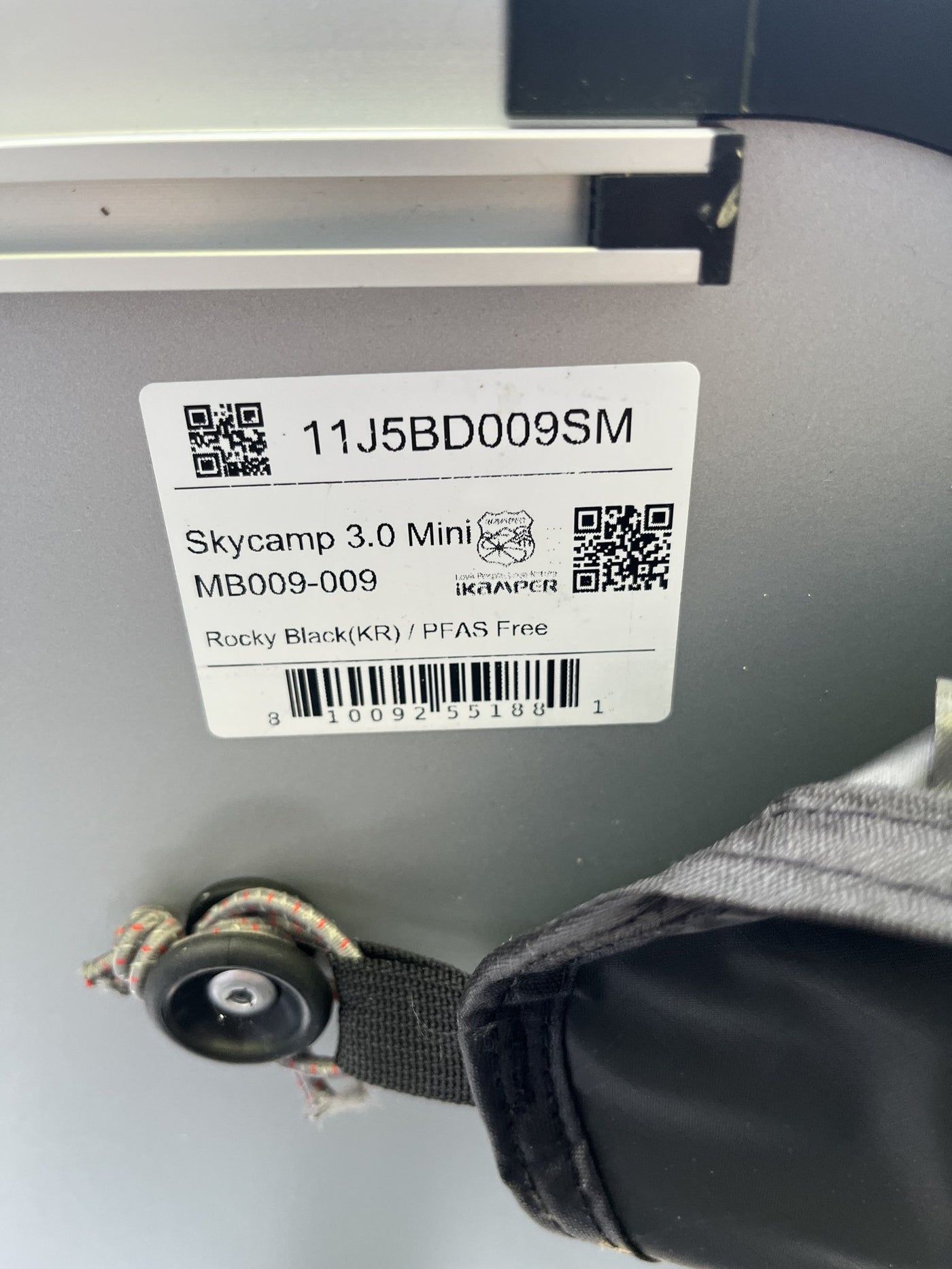Manufacturer label on the tent reading Skycamp 3.0 Mini, MB009-009, Rocky Black (KR) / PFAS Free — photo 6