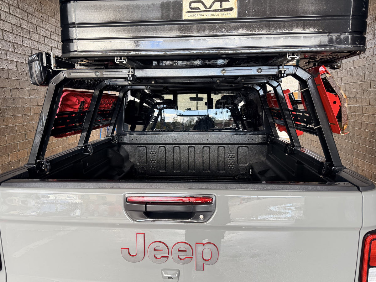 Full bed rack installed in a 5ft Jeep Gladiator bed, rear view showing both side rails, uprights and load bars — photo 2