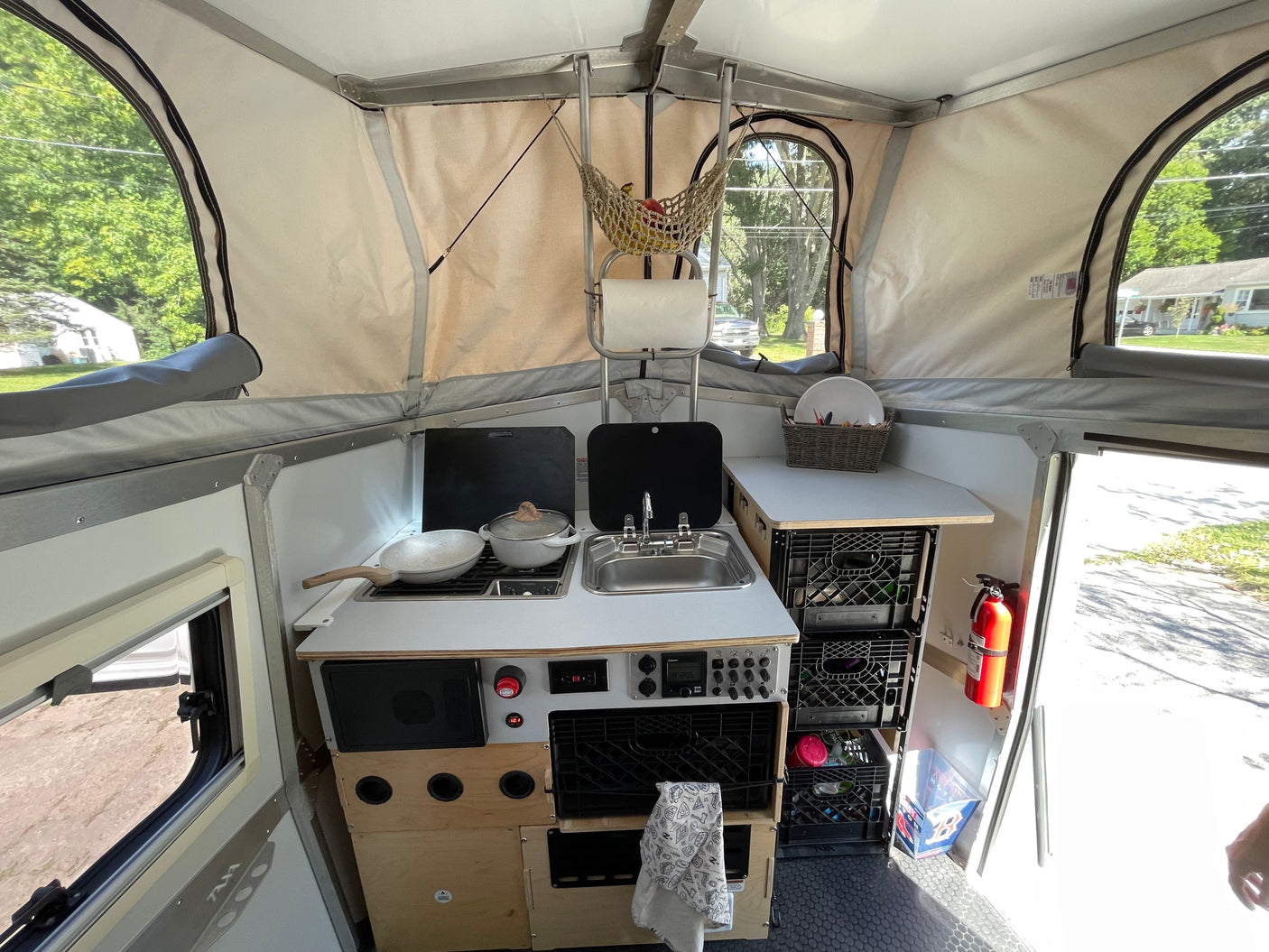 Step inside this compact pop-up camper's kitchen, ready for your next rv rental adventure.