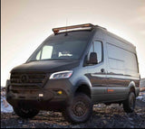 This dark gray off-road Mercedes Sprinter van, with rugged bumper & roof light bar, is ideal for RV rental.