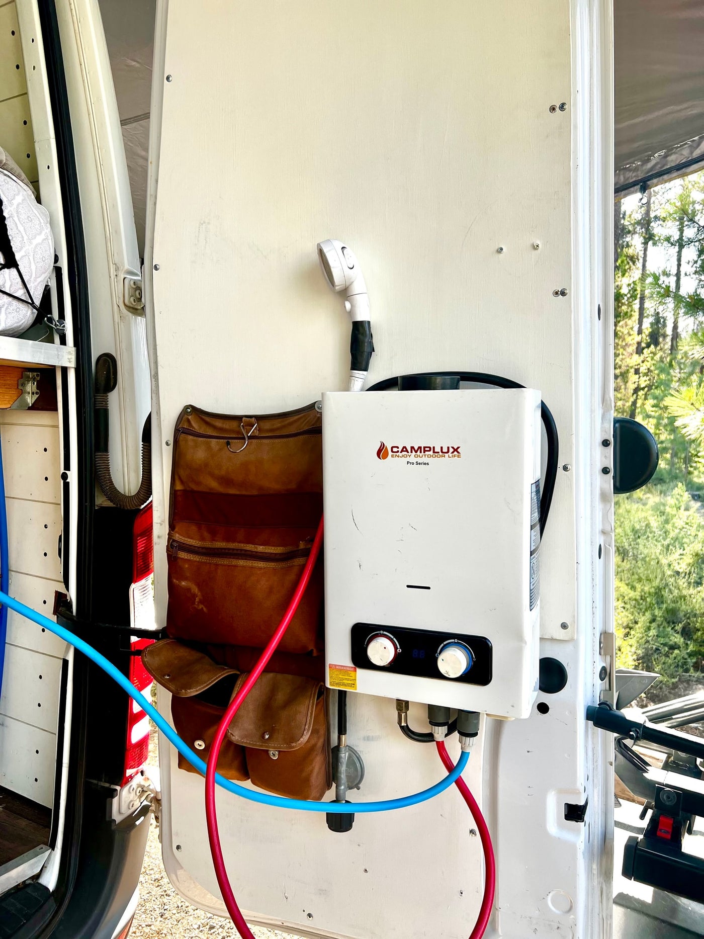 Outdoor CAMPLUX water heater & shower setup on an RV rental door, ideal for camping and van life adventures. — photo 17