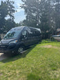Dark grey Ram ProMaster rv rental van on a driveway