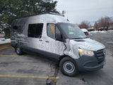 This Mercedes-Benz Sprinter rv rental features a unique topographic map wrap, ideal for travel & outdoor adventures.