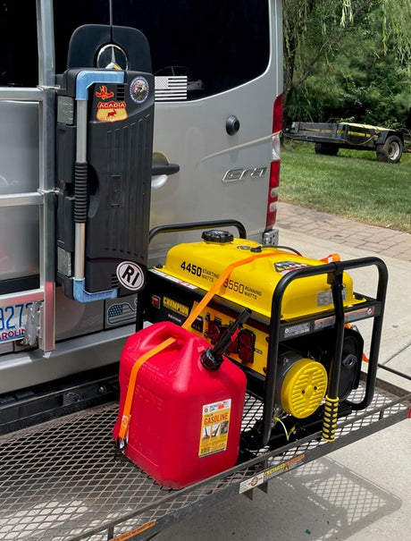 RV rental with a large yellow generator & red gas can secured on a rear cargo carrier, ready for off-grid adventures.