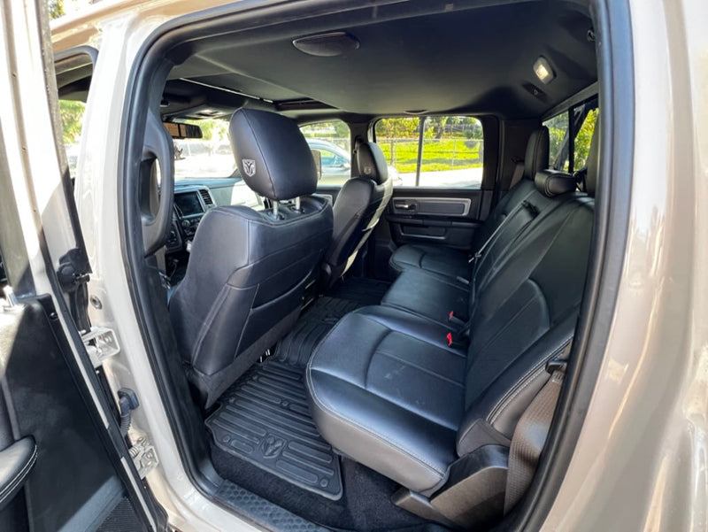  a great alternative to an RV rental.|Overland adventure setup: Pickup truck with open hard-shell tent/storage on bed. Perfect for an RV rental alternative.|Detailed view of a Ram Power Wagon truck's spacious black leather interior & dashboard — photo 6