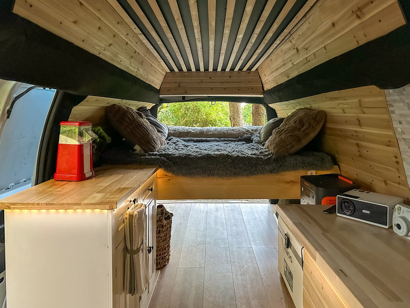  offering a glimpse of the outdoor camp setup.|Well-organized RV rental drawer filled with Seattle's Best coffee — photo 11