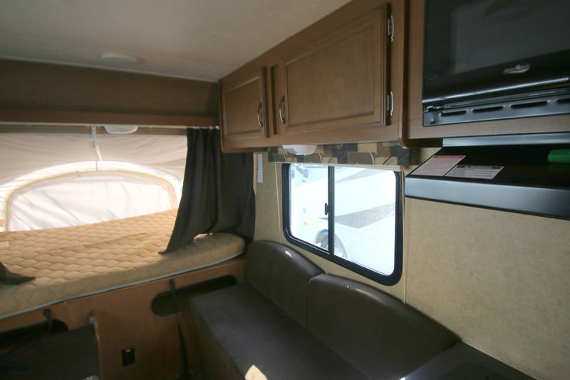  and a cozy pop-out bed.|RV rental: Inside a pop-up camper — photo 8