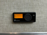 Eberspächer RV rental heater control panel. Orange display shows "Heater" and "Off," with a large rotary dial for climate comfort.