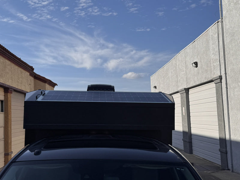 Roof of the Moonlander X showing the 200W solar panel package and MaxxAir Deluxe roof fan — photo 6