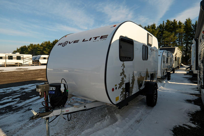  and overhead storage.|Bright RV rental interior with a functional kitchen