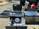 Enjoy an rv rental adventure with this compact camping kitchen featuring a sink, stove, fridge, and organized dish storage.
