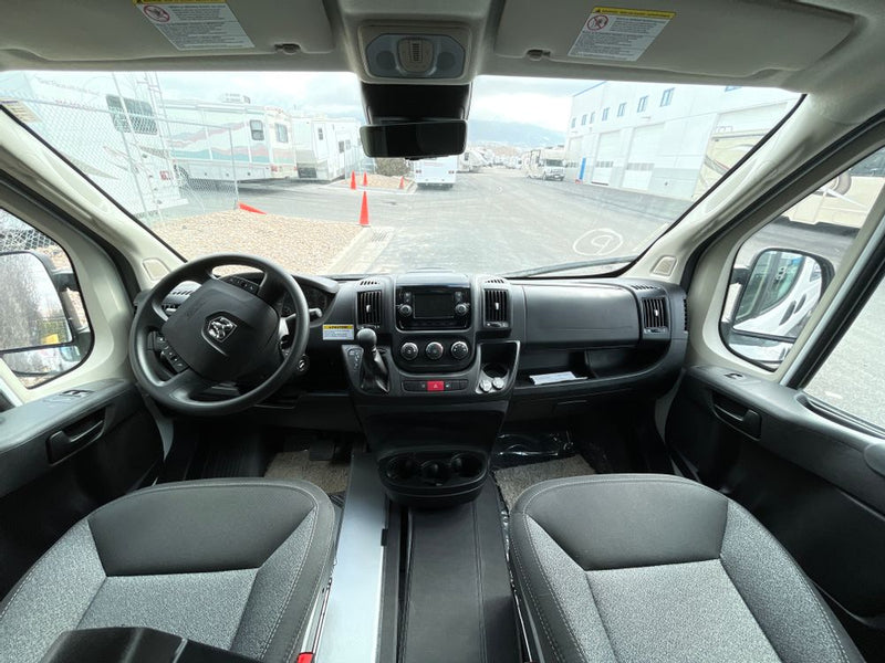  perfect for travel. See this camper van's setup.|Inside an RV rental: A compact camper van interior showing a kitchen with sink and stovetop — photo 5
