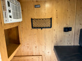RV rental interior showing a Black+Decker AC unit, "TV Backer" area, storage net, Dometic control, and USB port.