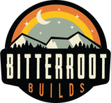 Bitterroot Builds RV rental logo: mountains, forest, moon, stars, and a rainbow arch, capturing adventure.