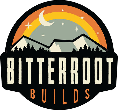 Bitterroot Builds RV rental logo: mountains, forest, moon, stars, and a rainbow arch, capturing adventure.