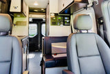 RV rental interior: Modern camper van with front seats, dinette, control panel, and overhead storage.