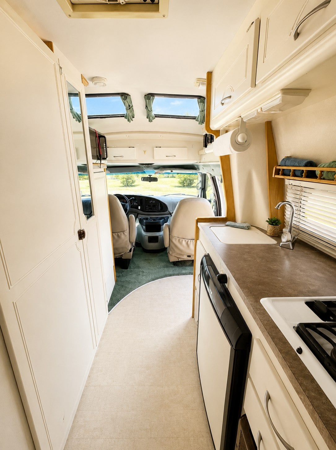  with chairs ready for outdoor leisure.|The rear of a white Pleasure-Way van RV — photo 8