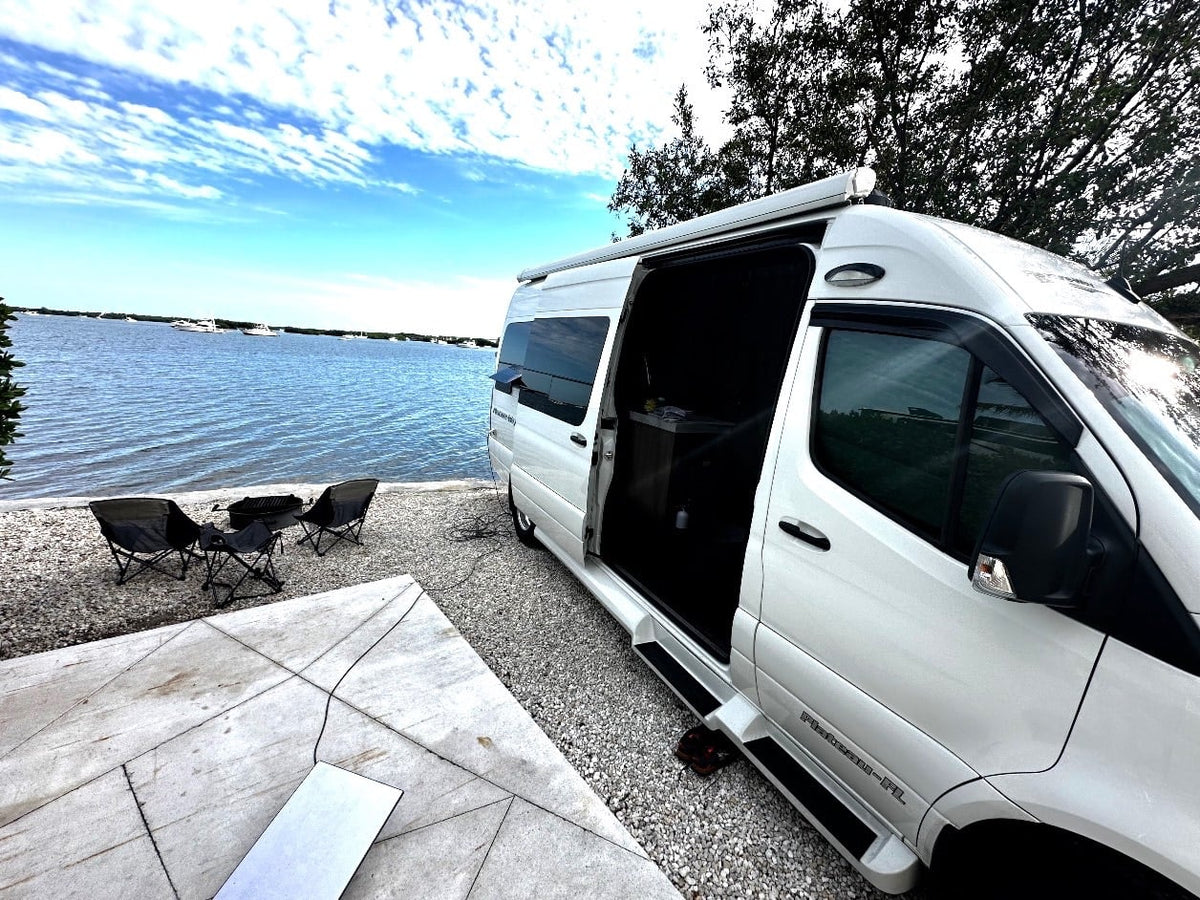  and a nearby kitchenette.|Comfortable RV rental interior: front cabin with rotating seats — photo 8