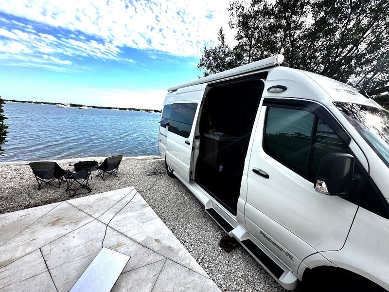  and a nearby kitchenette.|Comfortable RV rental interior: front cabin with rotating seats — photo 8