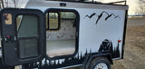 Cozy RV rental camper: custom bear and mountain exterior, warm interior with birch tree & bird wallpaper. Perfect for outdoor adventure.