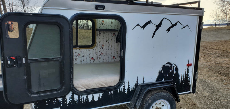 Cozy RV rental camper: custom bear and mountain exterior, warm interior with birch tree & bird wallpaper. Perfect for outdoor adventure. — photo 5