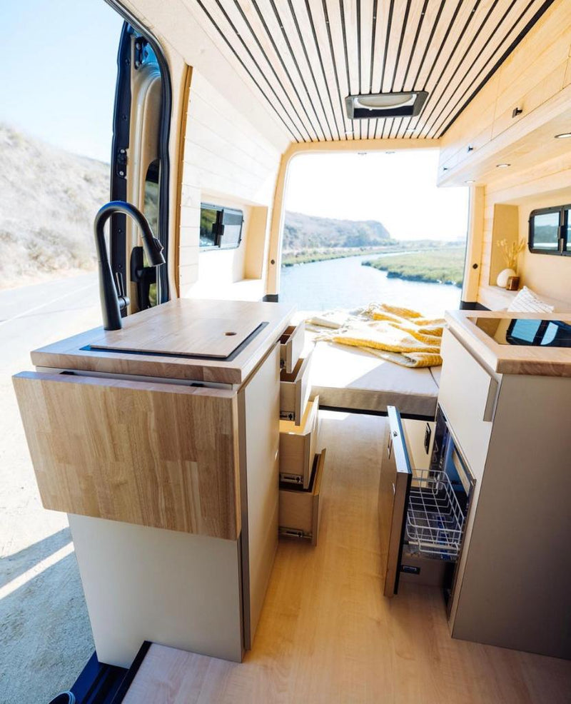  parked on a dirt path.|This cozy RV rental offers a modern wood interior — photo 6