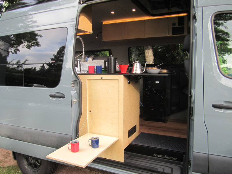  with a pop-top roof tent in a grassy field at sunset — photo 9