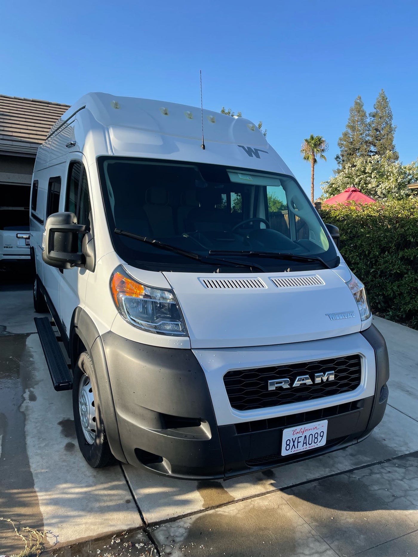  ideal for outdoor adventures.|A white Winnebago RV rental van — photo 2