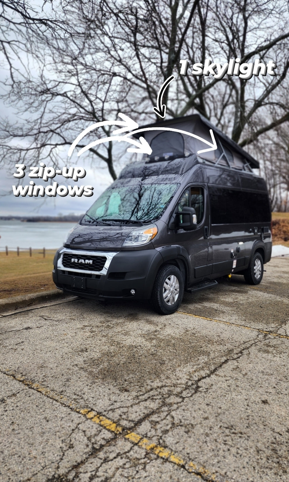 This dark gray RV rental features a pop-top with 3 zip-up windows and 1 skylight, perfect for van life adventures.