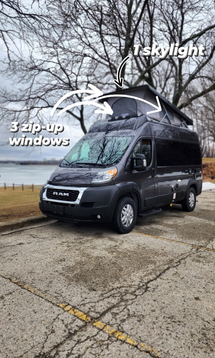 This dark gray RV rental features a pop-top with 3 zip-up windows and 1 skylight, perfect for van life adventures.