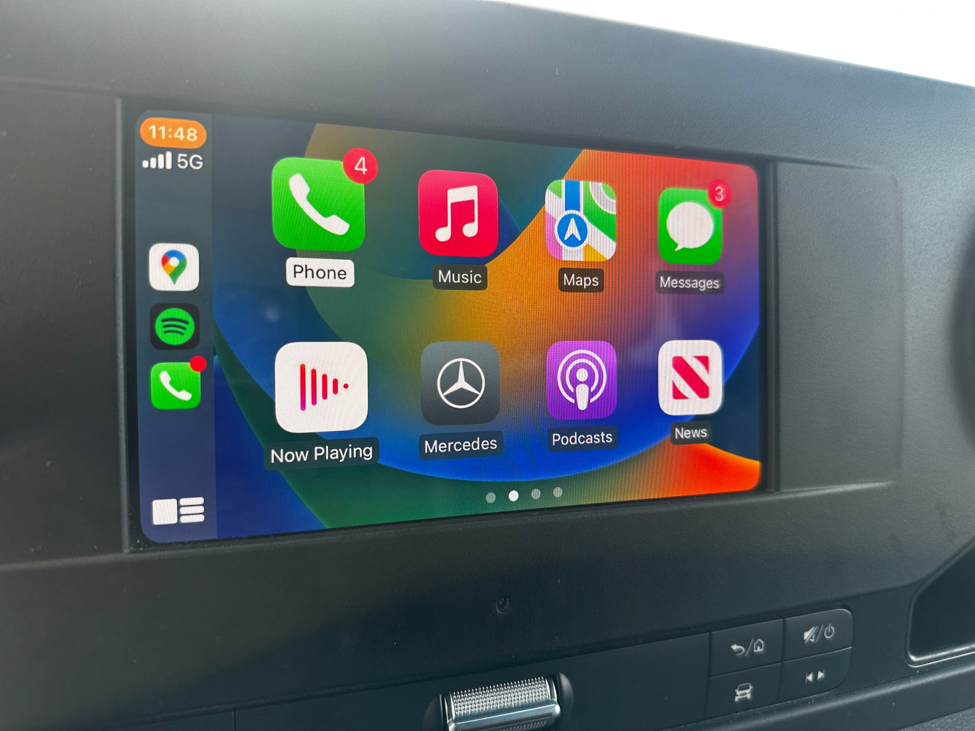 Apple CarPlay on an RV rental's screen: Phone (4 new), Messages (3 unread), Maps, Music, and more apps, with 11:48 time & 5G.