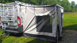 This RV rental camper van extends its living space with a large attached awning for camping.