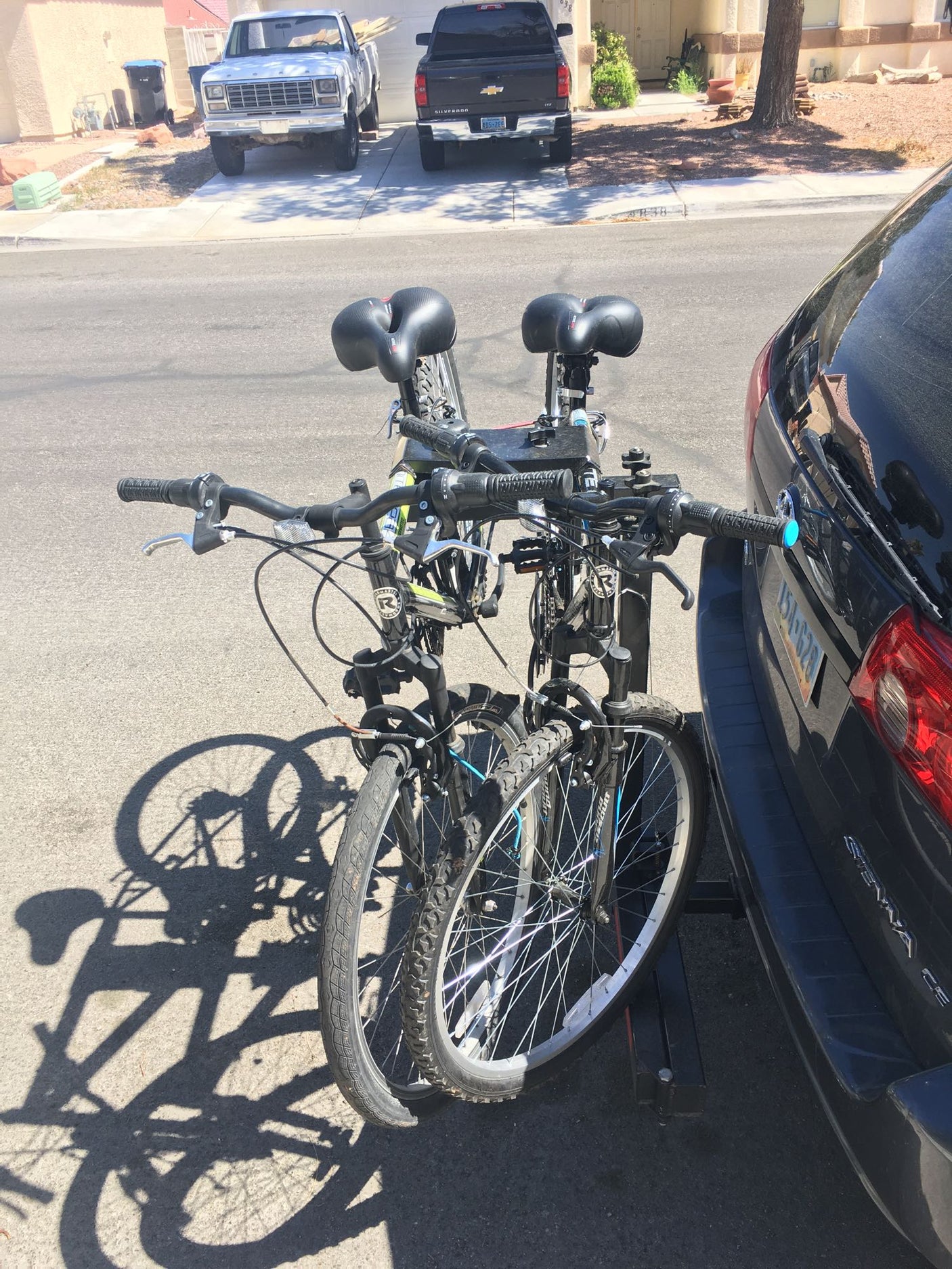 Two bikes mounted on a car rack, ready for an RV rental trip or road adventure.