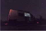 Stargazing from a cozy RV rental! This camper van under a starry night offers the perfect camp adventure.