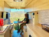 Work remotely from your RV rental! Enjoy stunning mountain views from this modern camper van's comfortable interior.