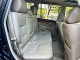 Spacious light leather rear seating in a comfortable SUV, ideal for your next rv rental adventure.