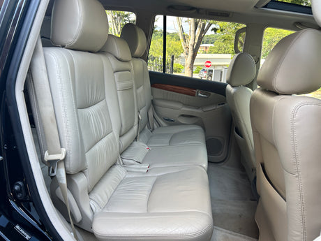 Spacious light leather rear seating in a comfortable SUV, ideal for your next rv rental adventure.