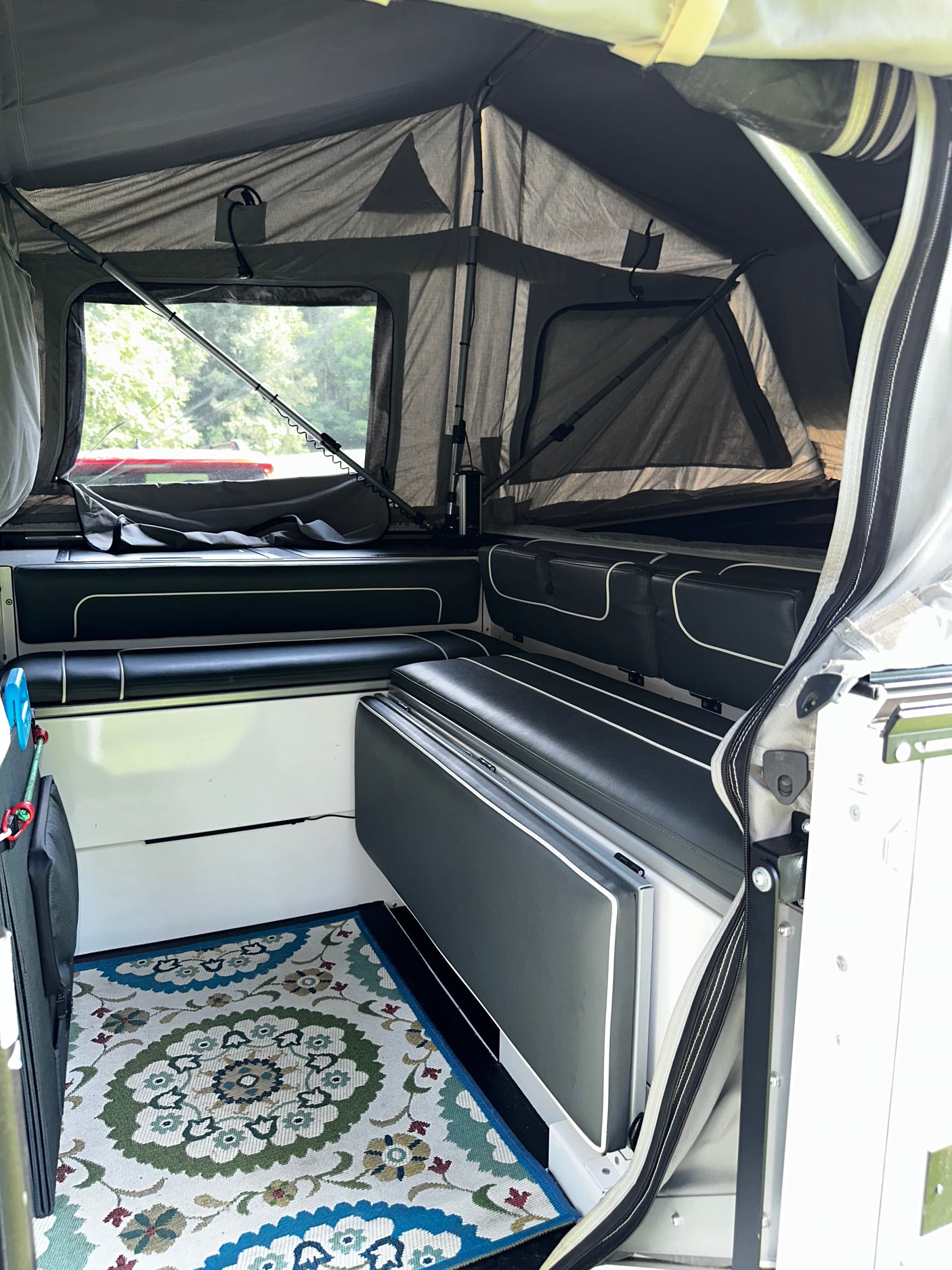 Interior bench seating with rug, staged view