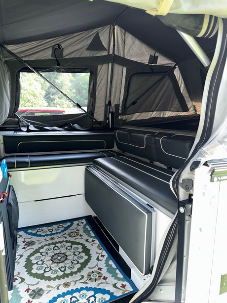 Interior bench seating with rug, staged view