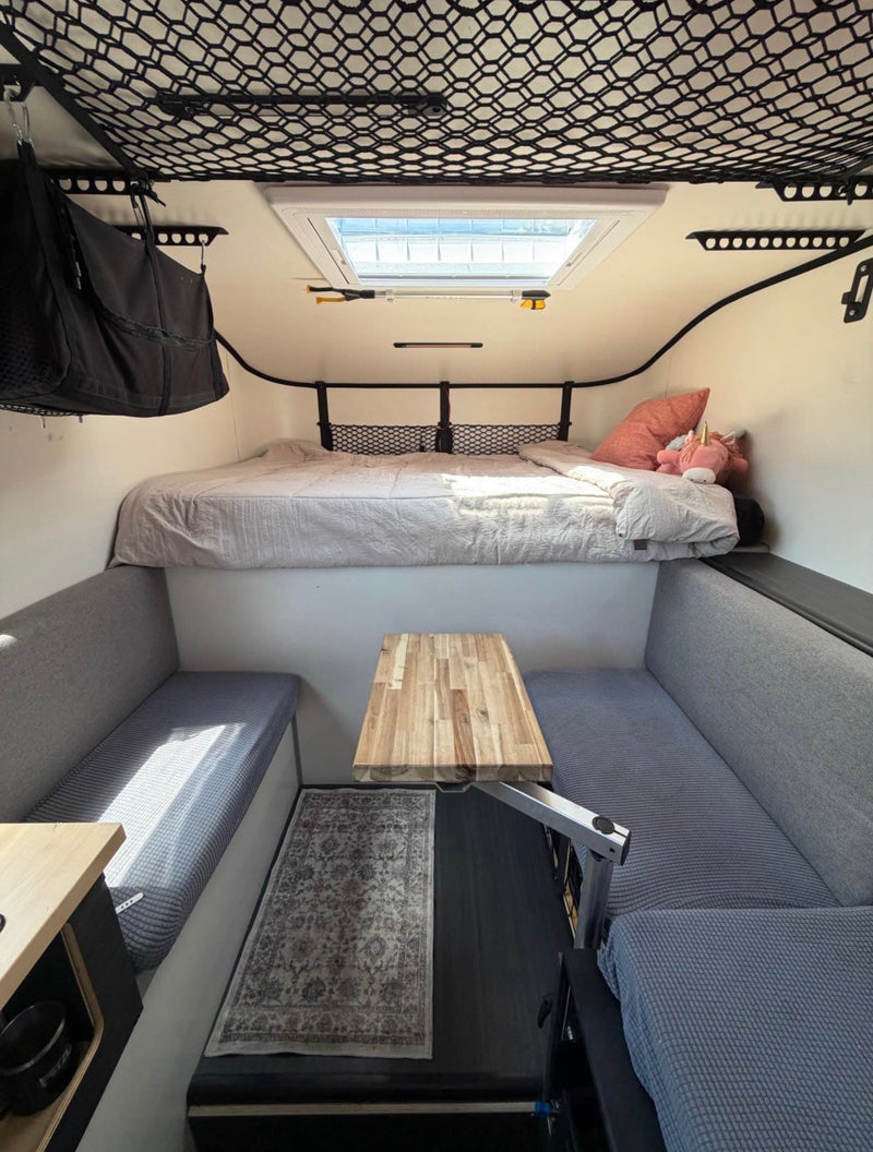  ready for adventure.|A bright white Scout Olympic truck camper — photo 2