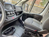 RV rental van's passenger interior: dashboard with Pioneer screen, climate controls, cupholders, and fabric seat.