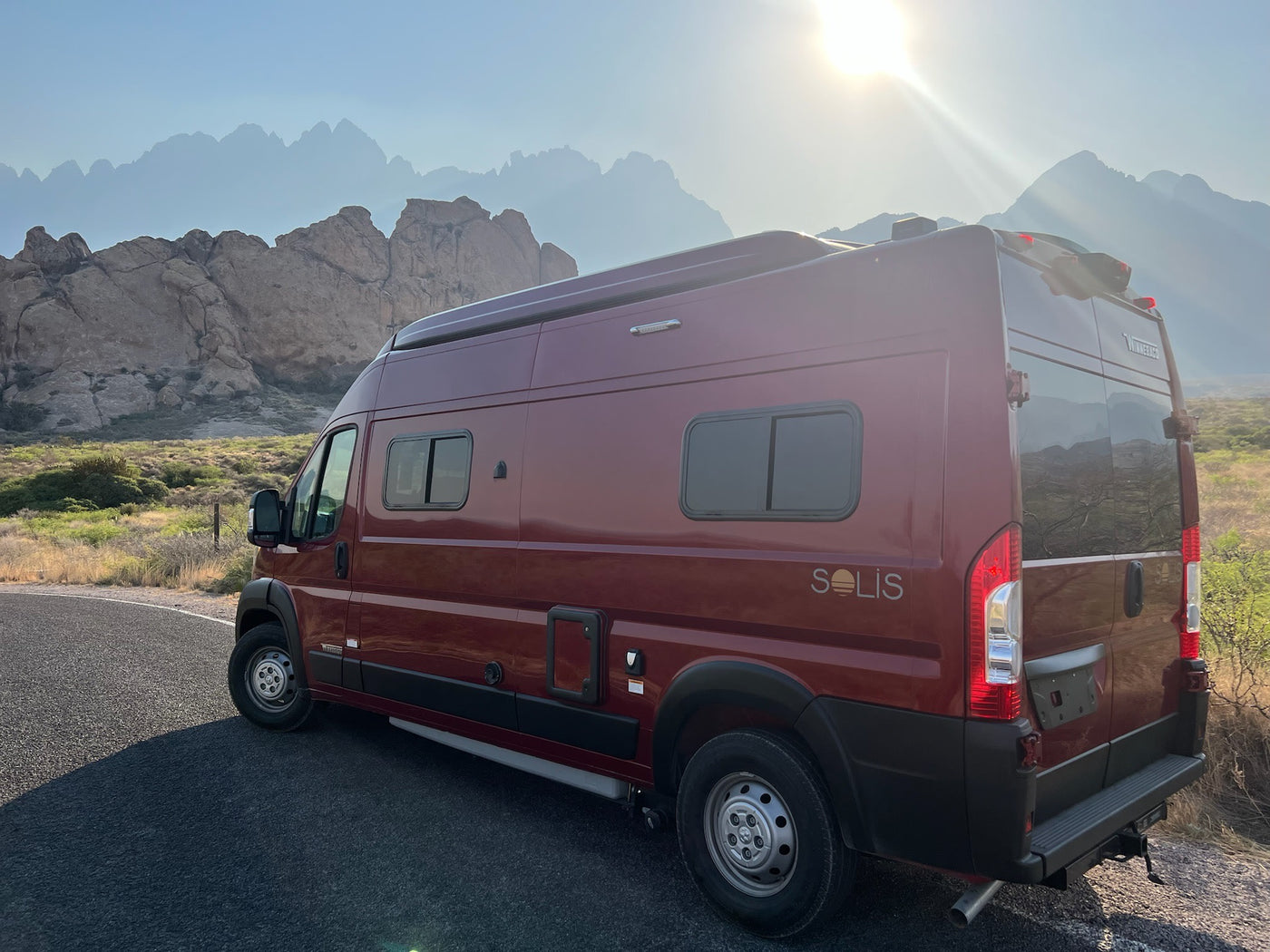  sunny sky. Ready for adventure!|Red RV rental travels a pristine white sand road among vast dunes under a clear blue sky. A unique desert journey.|Experience desert stargazing from your RV rental: a red camper van beneath the Milky Way — photo 5