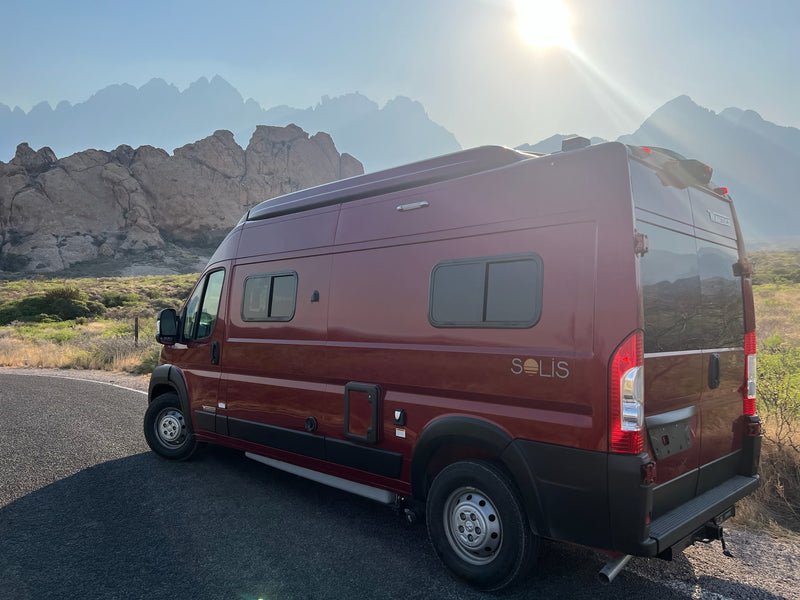  sunny sky. Ready for adventure!|Red RV rental travels a pristine white sand road among vast dunes under a clear blue sky. A unique desert journey.|Experience desert stargazing from your RV rental: a red camper van beneath the Milky Way — photo 5