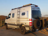 Silver Winnebago Sprinter 4x4 camper van, equipped for adventure. Ideal for your next **rv rental** trip!