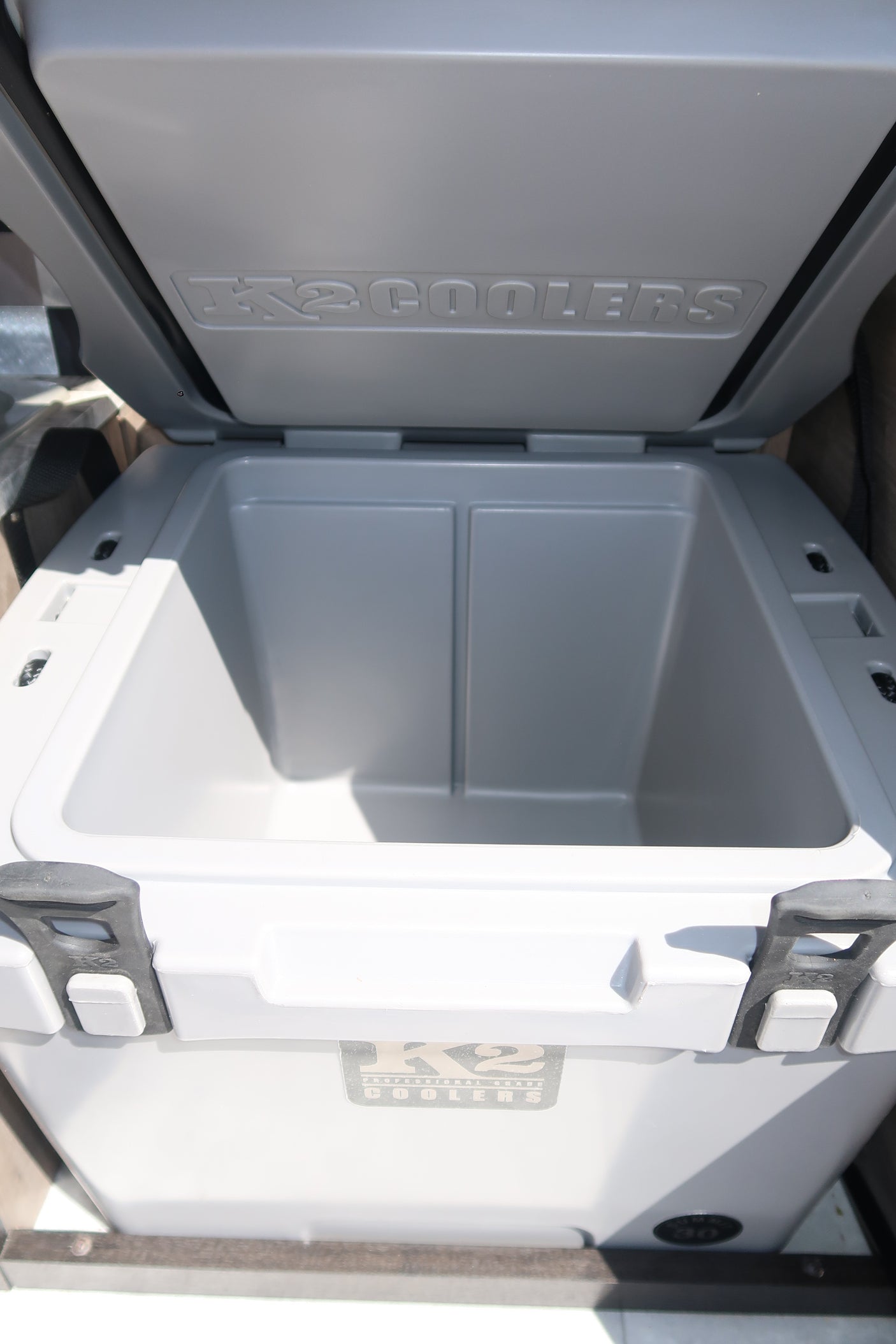 Open K2 cooler in an RV rental, showing a clean interior ready for beverages and food.