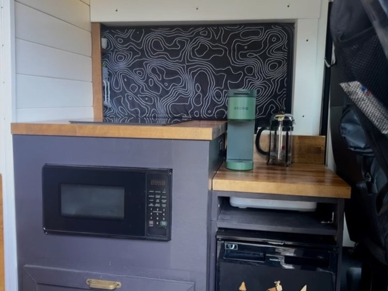  and a cozy bed. Guidebook ready!|A beige Ram ProMaster camper van — photo 4