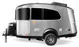 Sleek silver travel trailer, ideal for your next RV rental adventure. This compact camper features dark windows & off-road tires.